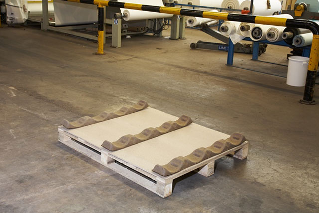 Place required number of Stakkers, or half Stakkers, flat side down on the pallet.